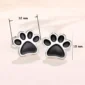Boucles d’Oreilles Pattes de Chien en Acier (dimensions).