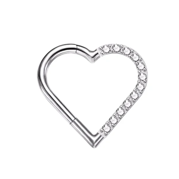 Piercing Cœur Asymétrique en Titane à Zircons Sertis (variante couleur brut et zircons à droite) Piercing Cœur Asymétrique en Titane à Zircons Sertis (variante couleur brut et zircons à droite).