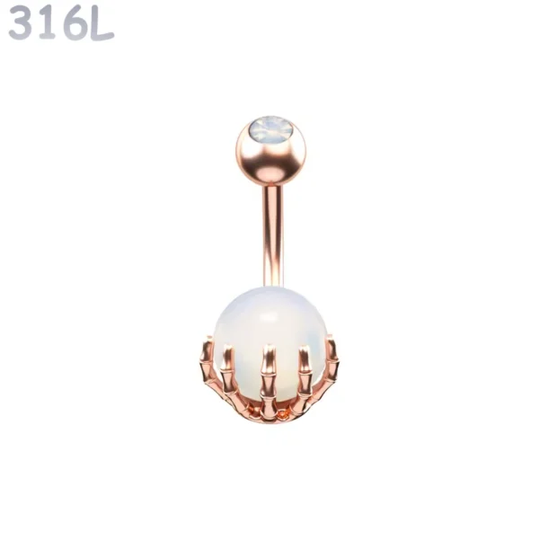 Piercing Nombril Sphère Blanche Sertie d’une Main Squelettique Acier 316L Or Rose PVD Piercing Nombril Sphère Blanche Sertie d’une Main Squelettique Acier 316L Or Rose PVD.