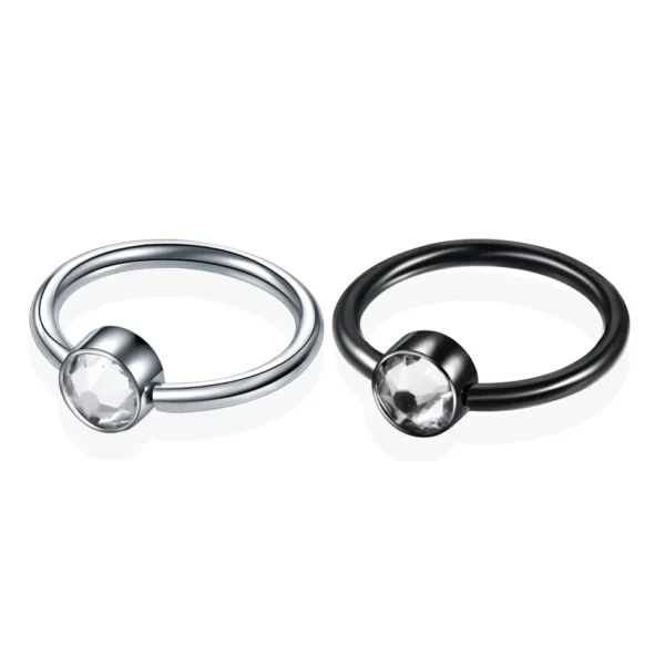 Piercing Anneau Captif en Titane doté d'un cylindre serti de zircon (2e prise de vue) Piercing Anneau Captif en Titane doté d'un cylindre serti de zircon (2e prise de vue)