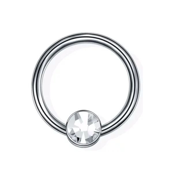 Piercing Anneau Captif en Titane doté d'un cylindre serti de zircon (couleur titane) Piercing Anneau Captif en Titane doté d'un cylindre serti de zircon (couleur titane).