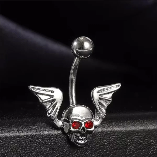 Piercing Nombril Tête de Mort Ailée en Acier et Zircons Rouges (expo) Piercing Nombril Tête de Mort Ailée en Acier et Zircons Rouges (expo).