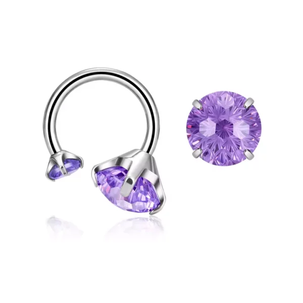 Piercing Fer à Cheval Titane à Embouts Zirconiums Asymétriques (variante violet) Piercing Fer à Cheval Titane à Embouts Zirconiums Asymétriques (variante violet).
