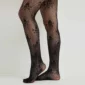 Collant Gothique en Résille Noire à Pois et Crânes.