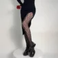 Collants Résille Noirs Dépareillés à Symboles de Cartes ♠ ♥ ♦ ♣.