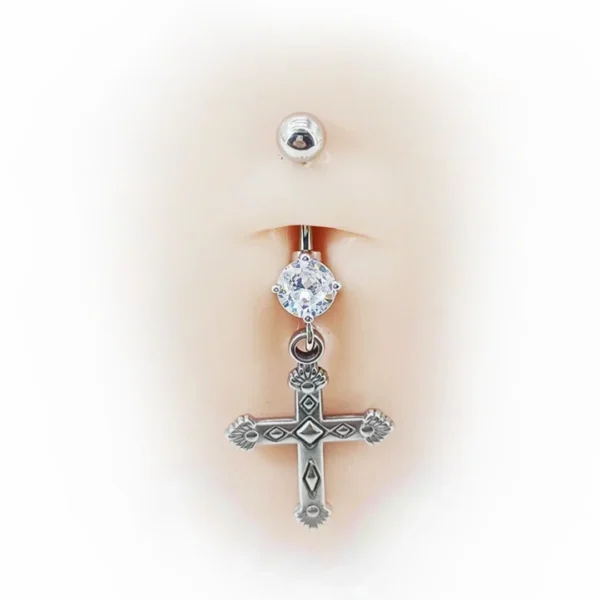 Nombril Femme avec un Piercing Titane à Zircon Lumineux et Pendentif Croix Nombril Femme avec un Piercing Titane à Zircon Lumineux et Pendentif Croix.