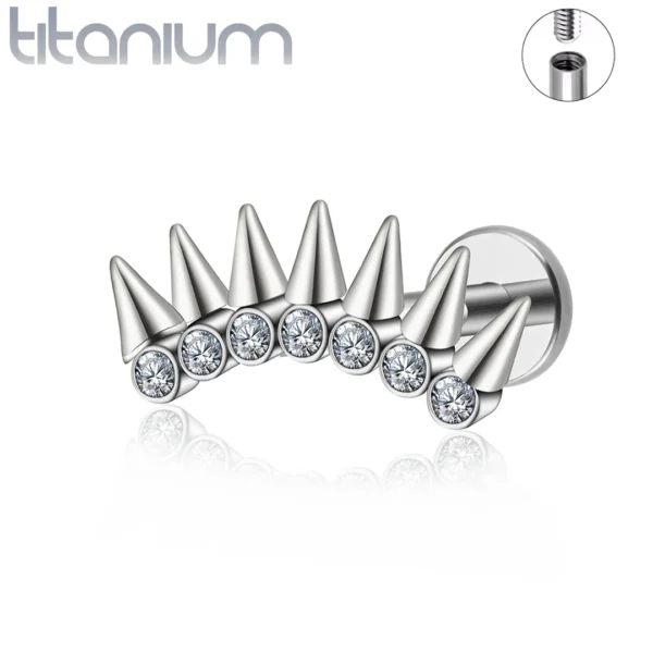 Piercing Labret Titane à 7 Pointes Coniques sur Base Sertie Piercing Labret Titane à 7 Pointes Coniques sur Base Sertie.