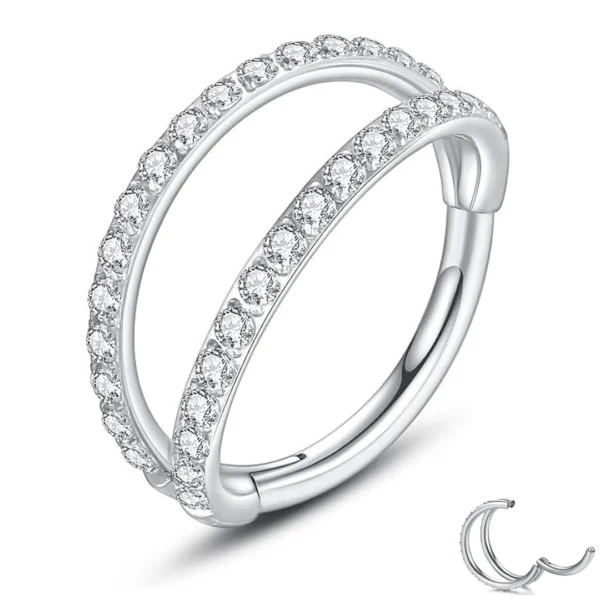 Piercing Double Anneau Clicker Pavé de Zirconiums (variante titane poli Ø 8 mm) Piercing Double Anneau Clicker Pavé de Zirconiums (variante titane poli Ø 8 mm).