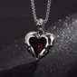 Collier Double Crâne formant un Cœur Acier Chirurgical 316L.