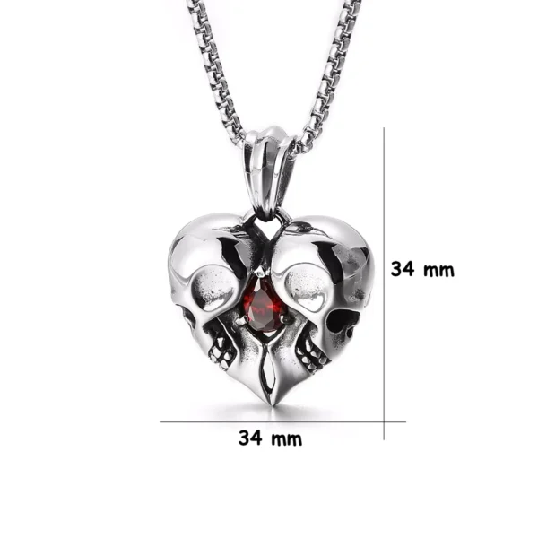 Collier Double Tête de Mort Cœur Acier 316L et Zircon Rouge (dimensions) Collier Double Tête de Mort Cœur Acier 316L et Zircon Rouge (dimensions).