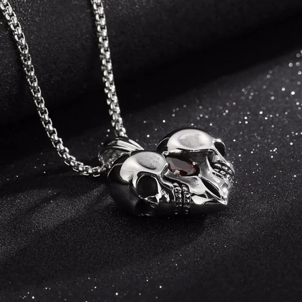 Collier Gothique Double Tête de Mort Cœur Acier Inox Collier Gothique Double Tête de Mort Cœur Acier Inox.