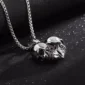 Collier Gothique Double Tête de Mort Cœur Acier Inox.